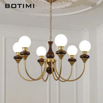 lustres modernes chandelier or marron foncé ampoules led globes opaques éléments décoratifs