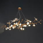 Suspension lumineuse moderne oiseaux transparents branches dorées fleurs blanches led verre chrome poli chambre
