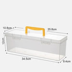 boîte outils transparente poignée jaune contenant vis boulons clous tournevis clé rubans adhésifs pratique