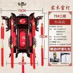 lanterne traditionnelle chinoise bois sculpté rouge décorative pompon fête mariage jardin