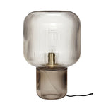 Vue de côté de la lampe champignon orange avec corps noir