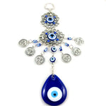 Pendentif oeil turc bleu argenté motifs géométriques artisanal protection maison