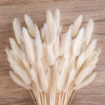 décoration maison plumes séchées blanches naturelles vase motif relief boîte papier brun corbeille osier