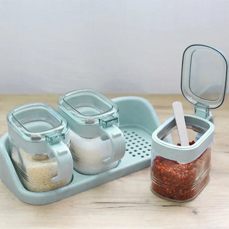 boîtes épices transparentes verre moderne rose verte bleu poignées couteau service herbes condiments cuisine