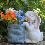 Statues lapins décoratifs fleurs artificielles blanc rose bleu texture fourrure