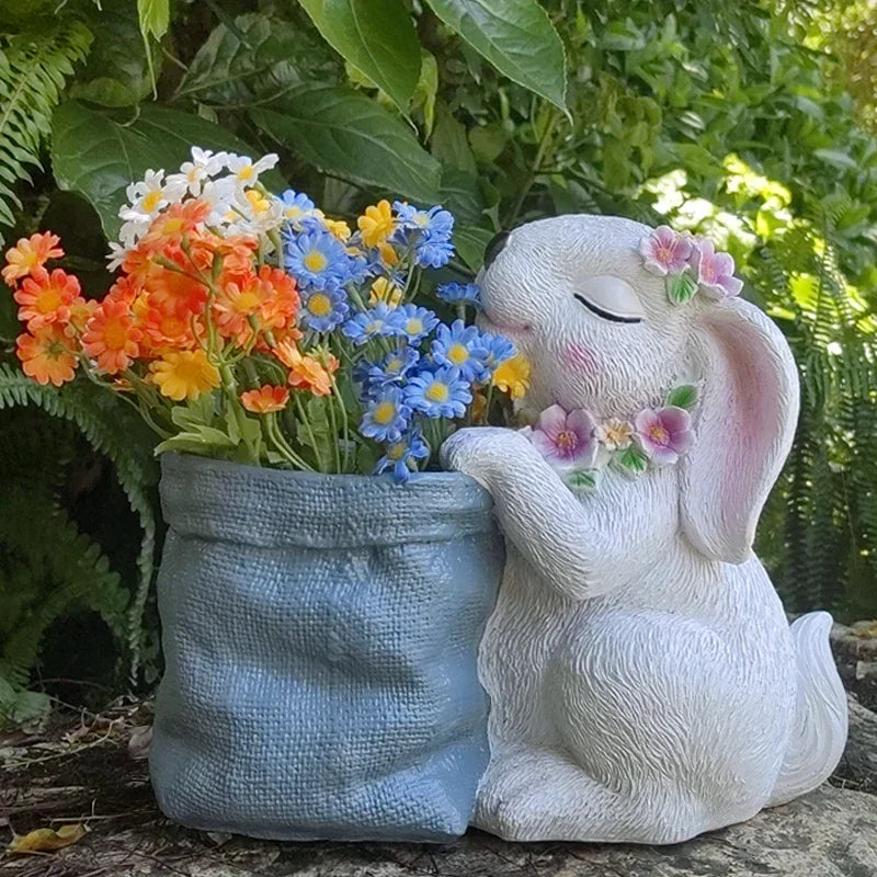 Statues lapins décoratifs fleurs artificielles blanc rose bleu texture fourrure