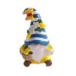 statue gnome decoratif jaune blanc marron citrons rayures chapeau barbe texturée intérieur extérieur jardin