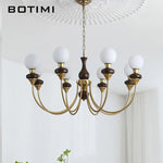 lustres modernes chandelier or marron foncé ampoules led globes opaques éléments décoratifs