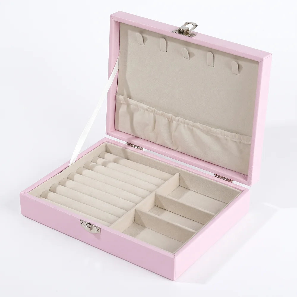 boîte bijoux velours doux moderne rose clair compartiments bagues colliers boucles oreilles élégante portable