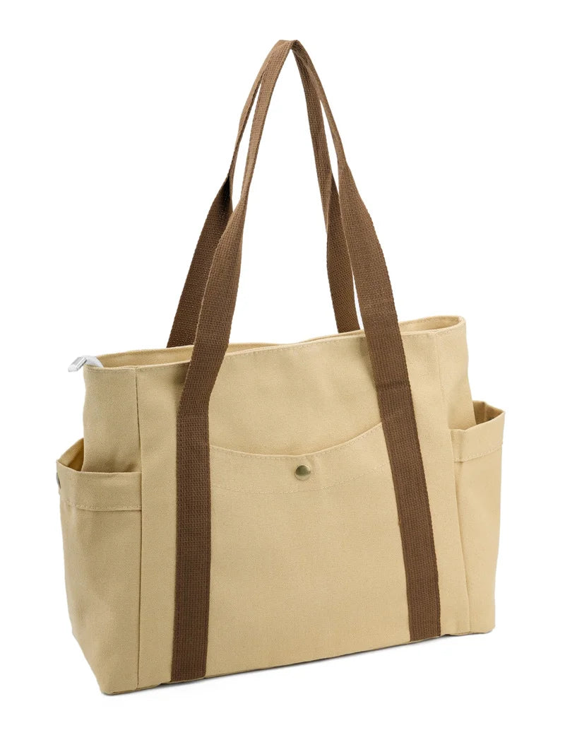 sac cabas noir toile voyage poches extérieures poche intérieure zippée anse tissu utilitaire décontracté