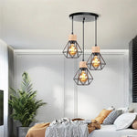 suspension lumineuse industrielle cage métal finition bois naturel ampoule filament noir moderne