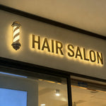 enseigne lumineuse moderne lettres relief couleur noire blanche dorée éclairage led opaque salon magasinextérieur