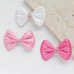 rubans forme noeud rayés pailletés blanc rose clips pinces décoration enfantine opaques nylon pack