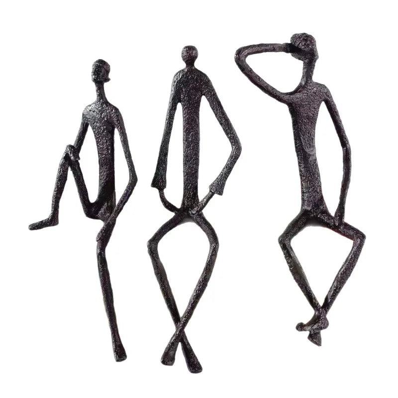 statues modernes minimalistes figures humaines assises noir texture brut forge lunettes livresintérieur