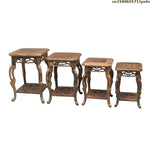 table basse bois rose classique gravures artisanal marron clair pot plante figurine cadre photo