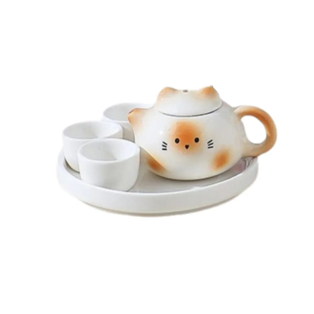 théière forme chat blanc rose vert jaune yeux noirs oreilles roses poils blancs décoration