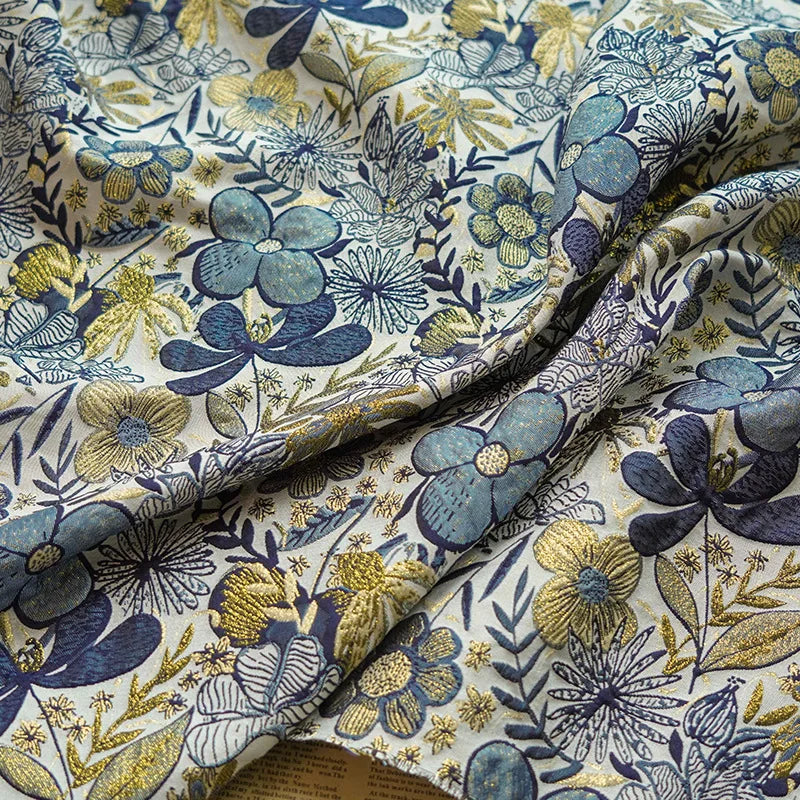 tissu imprimé fleurs stylisées blanc bleu vert moderne élégant polyester large 160cm résistant intempéries