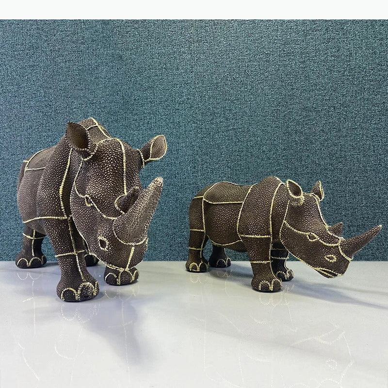 statuette rhinocéros marron foncé texture granuleuse décoratif animalier doré grande petite