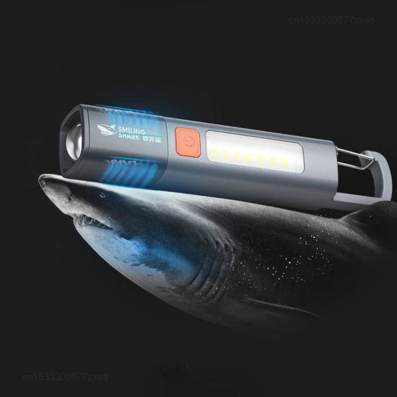 lampe torche rechargeable lumiere intense gris orange moderne anneau fixation interrupteur led