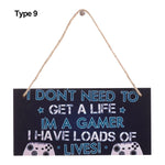 plaque décorative bois graphique texte jeu manette humoristique corde noire bleue adolescente chambre