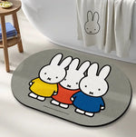 tapis bain dessin animé lapins gris jaune vert bleu rayures enfantin absorbant