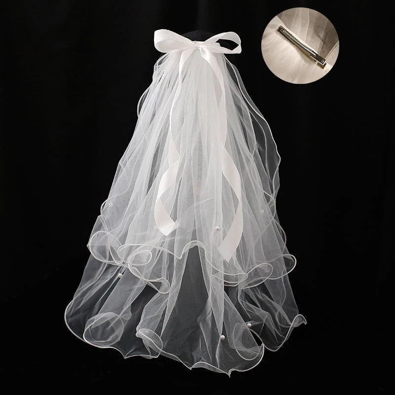 voile mariée tulle plissé blanc classique romantique fixé noeud transparent élégant