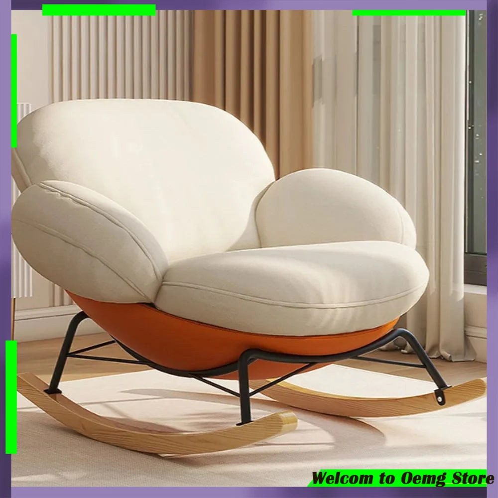 fauteuil bascule moderne beige noir orange roulettes coussin repos minimaliste salon
