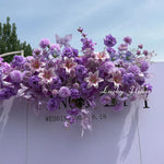 décoration mariage violettes roses blanches moderne élégante fleurs artificielles bouquet papillons feuilles vertesintérieur