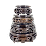 support circulaire bois sculpté artisanal traditionnel marron foncé détails complexes vase plantes décoration maison