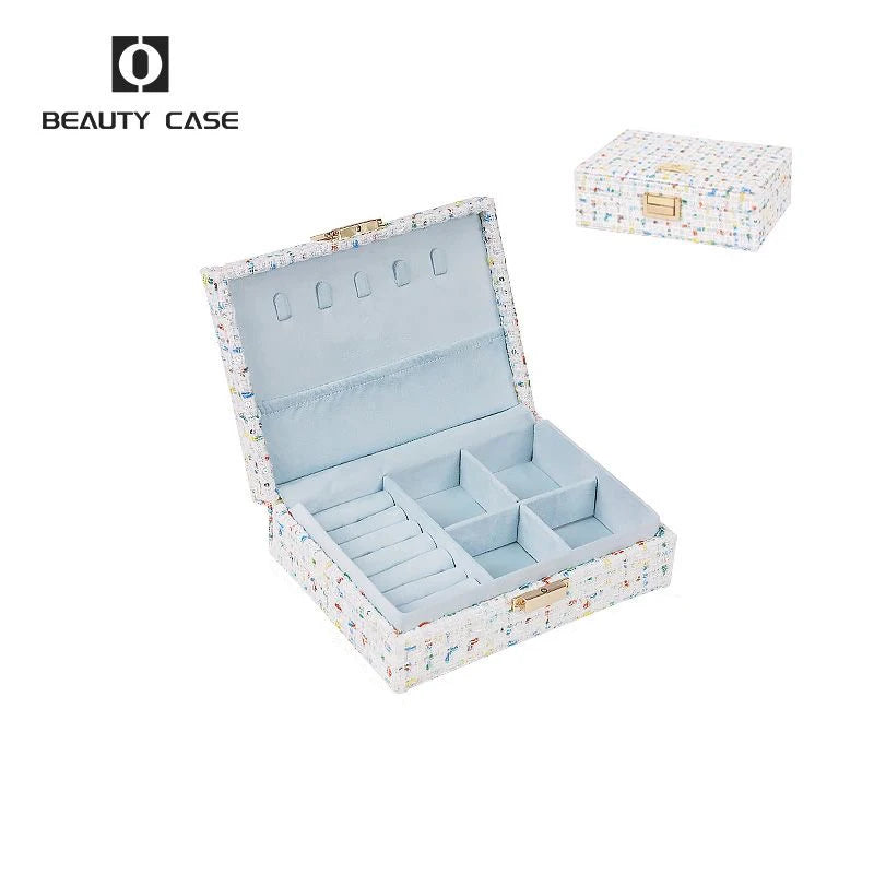 boîte bijoux tissu imprimé bleu clair compartiments poignée dorée classique opacité femmes