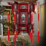lanterne traditionnelle chinoise bois sculpté rouge décorative pompon fête mariage jardin