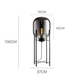 lampe sol moderne transparente ampoule filament noir gris fumé led verre minimaliste