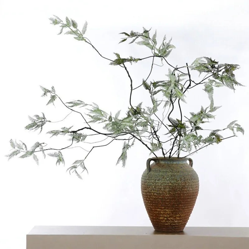 décoration intérieure branche artificielle feuilles naturelles vert clair brun minimaliste maison six pièces
