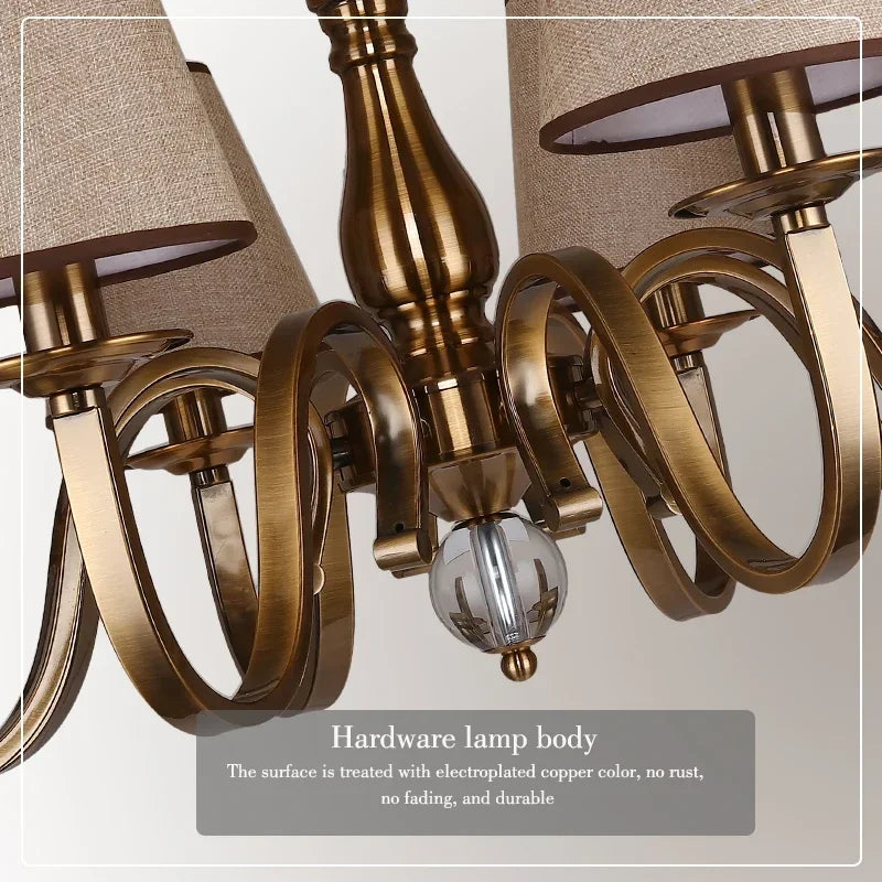 chandelier bronze classique suspension lumière abat jours tissu texturé courbes salle manger