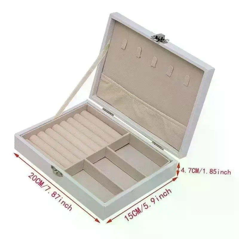 boîte bijoux simili cuir noir blanc rose compartiments cadenas classique organisation sécurité