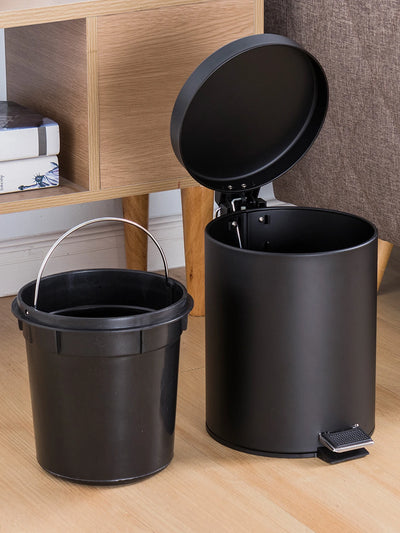 Mini poubelle ronde noire 3L avec couvercle dans une salle de bain moderne