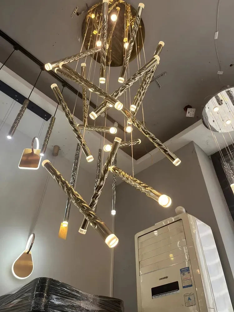 suspension lumineuse contemporaine dorée spirale brillante salon restaurant chambre principal