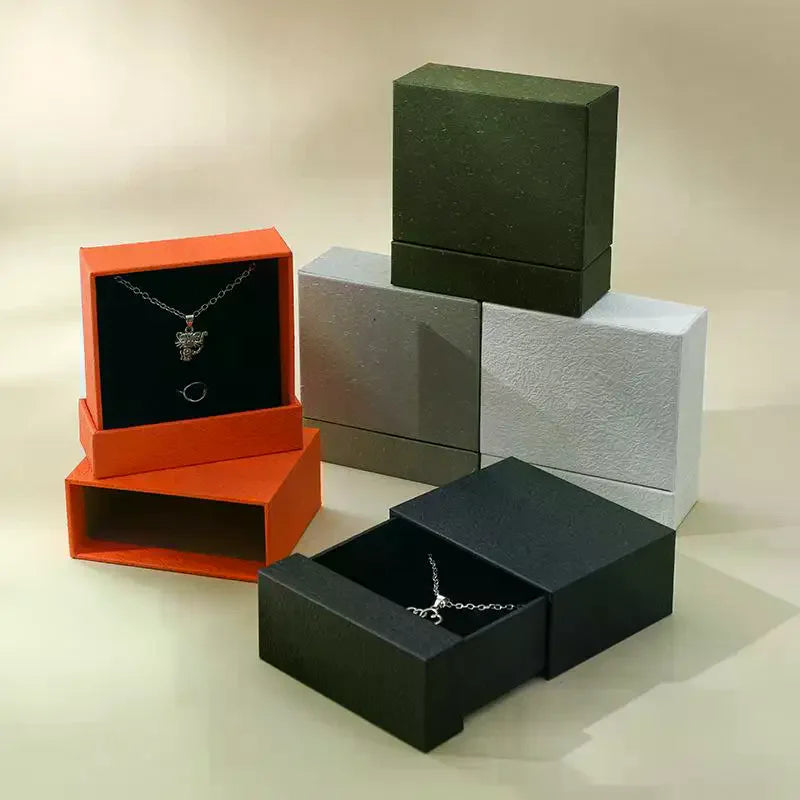 boîtes bijoux orange gris noir contemporaines compartiments pendentifs matées