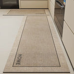Tapis de sol gris clair avec le mot "HOME" imprimé au centre, parfait pour l'entrée de la cuisine.