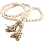 décoration murale guirlande bois boho rustique pompons beige farmhouse