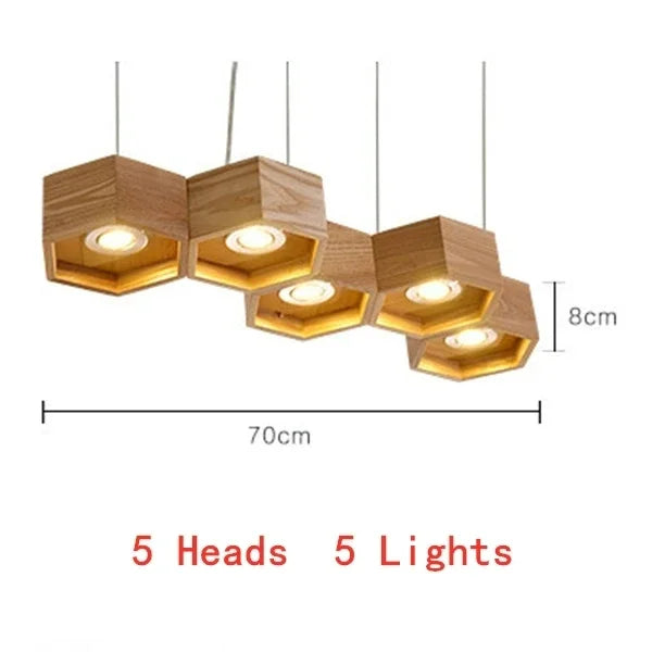 lumière suspendue bois clair nid d'abeille hexagonal modernes led câbles argentés structure géométrique