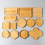 assiettes ovales rondes carrées supports plats texture bois moderne rustique bambou respectueux environnement