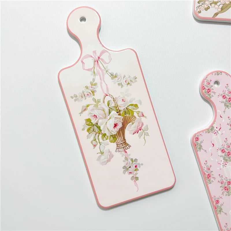 planche découper céramique vintage fleurs roses motifs géométriques blanc roseclair