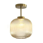 lampe suspendue or vert gris moderne rayures horizontales opacité fixations vis chambre salon éclairage