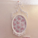 Cadre ancien avec image de fleur rose et blanche