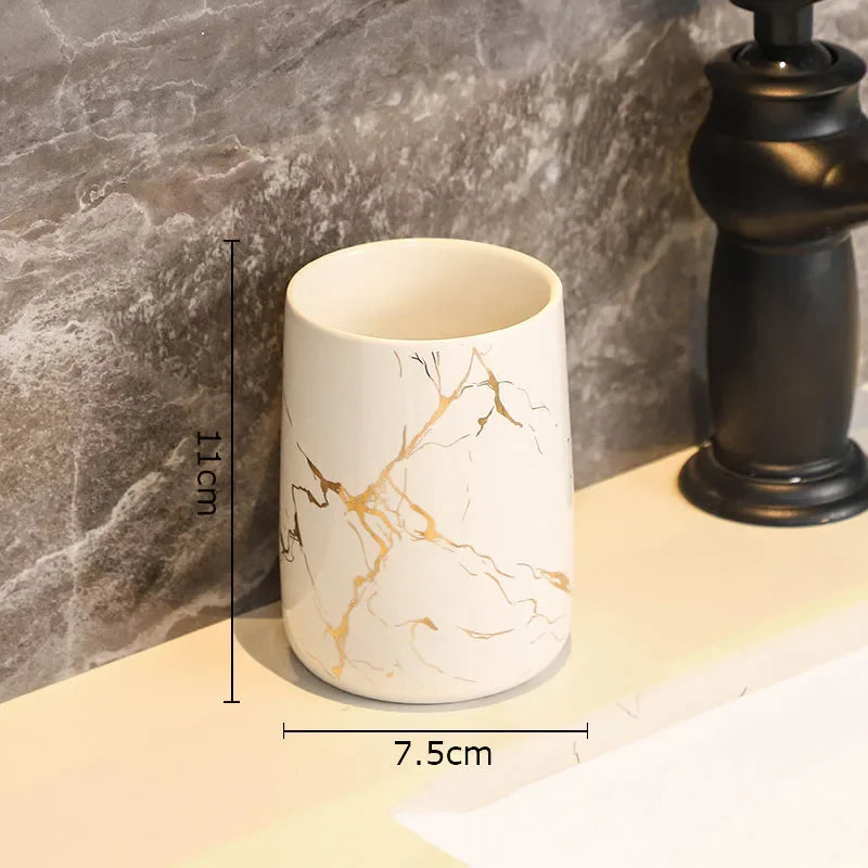 ensemble porte brosse dents porte savon marbre moderne or noir élégant bouteille parfum fleurs