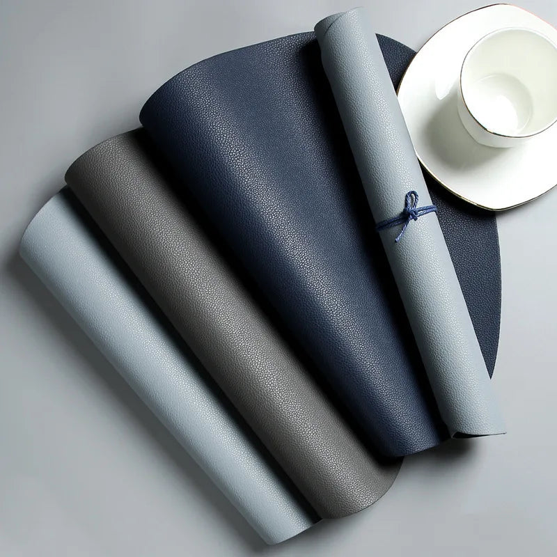 tapis table moderne gris bleu rose assiettes fourchettes cuillères tasses citrons texture cuir respectueux
