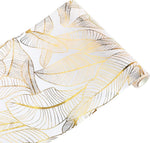 nappe moderne élégante feuilles dorées blanc décoration table serviettes assiettes verres