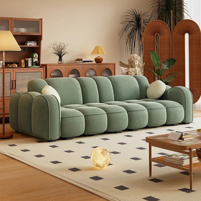 canapé d'angle moderne orange vert clair beige coussins contemporain minimaliste scandinave