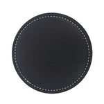Disque en cuir noir avec une finition lisse et des surpiqûres blanches, convenant à une utilisation décorative ou fonctionnelle.